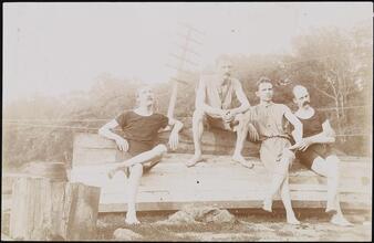 [Group of men on a beach.]