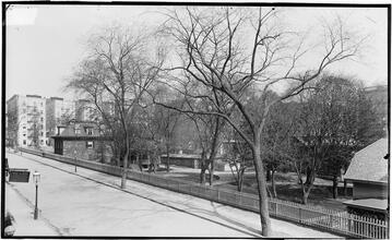 [Street Scene, Carriage House in a Small Park.]