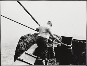 [Crew member working on the ferry.]
