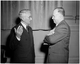Dale Carnegie [Dale Carnegie talking to a man.]