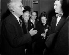 Dale Carnegie [Dale Carnegie talking to a group of people.]
