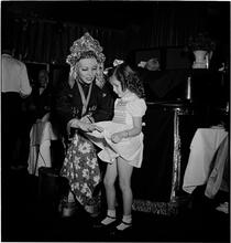 United Nations Children's Party [Child with a woman wearing a costume.]