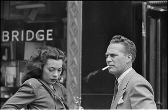 Street Conversations [Man and woman talking on the street.]
