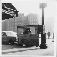 [Food vendor selling frankfurters and sausages.]