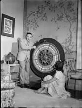 Billy Rose [Billy Rose with a large spinning object.]
