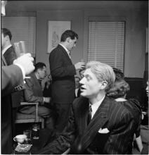 Leonard Bernstein [Leonard Bernstein talking to a group at a party.]