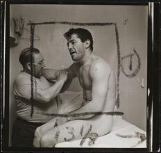 Rocky Graziano, He's a Good Boy Now [Man massaging Rocky Graziano's arm.]