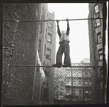 Shoe Shine Boy [Mickey climbing a fence.]