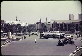 [The "Fountain of Atoms" and "American Womanhood" statue in front of the Home Furnishing Building.]
