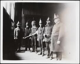 [Firemen in various firefighting gear.]