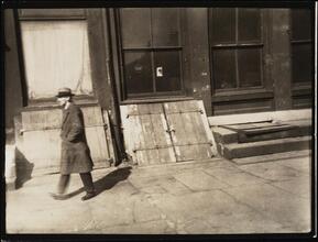 [South Street, with man walking.]