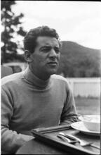 Leonard Bernstein [Leonard Bernstein sitting outside.]