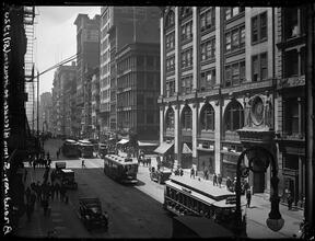 Broadway Series. West side of Bway looking south from near Bleecker toward Houston Street. Young's Hats on corner.