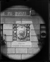 University Club seal on building wall.