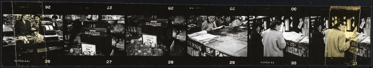 The 5 and 10 [Cash registers and a women looking at fashion catalogs at Woolworth's.]