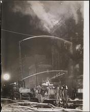 [Building on fire.]