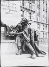 [Figure at base of Louis Kossuth memorial.]