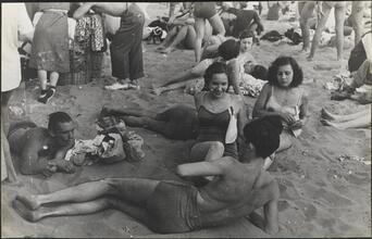 [People relaxing on Coney Island beach.]