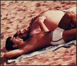 Untitled [Men on Coney Island beach.]