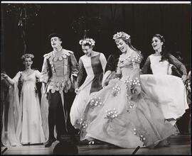[Julie Andrews as Guenevere and ensemble performing the number "The Lusty Month of May" in Act 1, Scene 5 of "Camelot".]