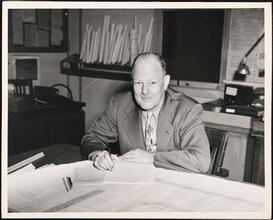 For 34 Years of Loyal Service - Eric S. Barron [Eric S. Barron at a desk.]