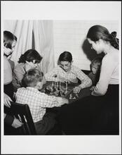 [Children playing chess at Ellis Island.]
