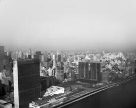 [Aerial view of Midtown Manhattan from the East River.]