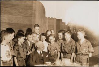 [Al Smith surrounded by Boy Rangers.]