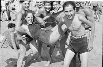 [Teenagers playing on Coney Island beach.]