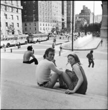 [Couple sitting on steps to the Met.]