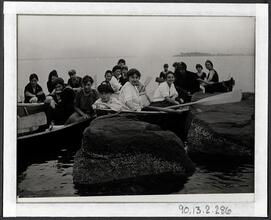 [Group of young people in row boats.]