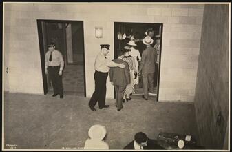 French Line, 610 Fifth Ave., "Normandie" Leaving Pier #88 N.R., Pier Scenes, Passengers Entering Elevators on Upper Level.