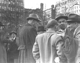 Untitled [Men in left-wing political discussions, Union Square]