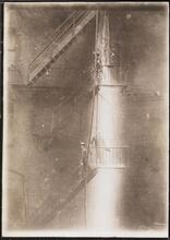 [Fire fighters on a fire escape.]