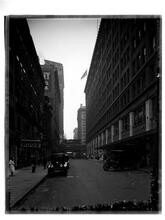 View looking east through 33rd Street, showing Gimbels & Saks stores.