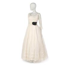 Evening dress of white lace over white net and satin