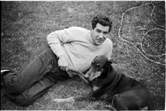 Leonard Bernstein [Leonard Bernstein with a dog.]