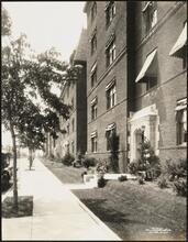 Chateau Apartments. Exterior with garden and landscaping