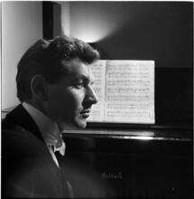 Leonard Bernstein [Leonard Bernstein at a piano.]