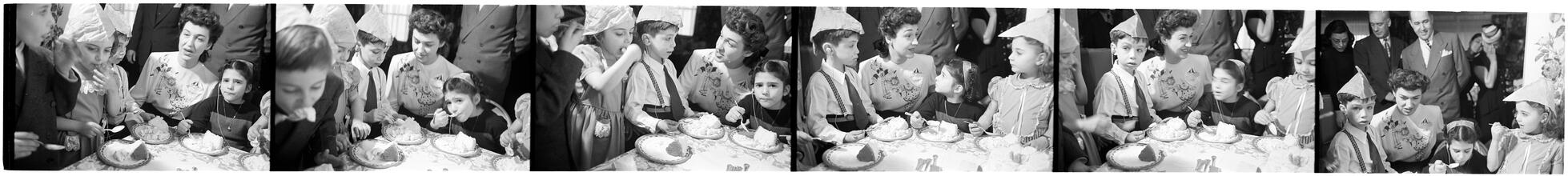 Deaf Children [Eating cake at a party.]