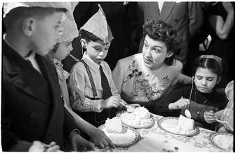 Deaf Children [Eating cake at a party.]