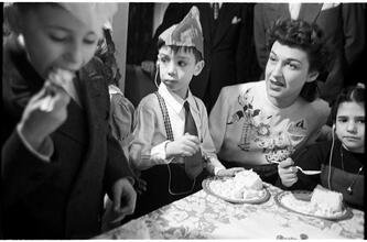 Deaf Children [Eating cake at a party.]