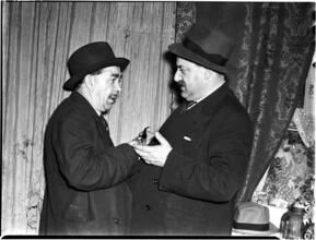 [Men shaking hands.]