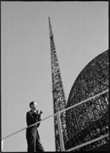 [Richard Wurts next to the frames of the Trylon and Perisphere during construction of the New York World's Fair site.]