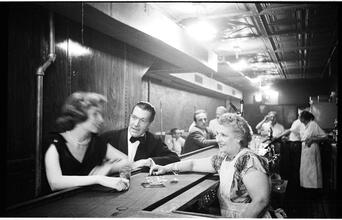 Peter Arno [Arno and a woman at a bar.]