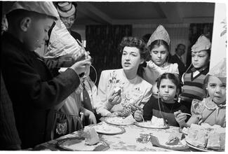 Deaf Children [Children eating cake at a party.]