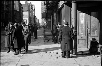 [Destitute men hanging out on sidewalk.]