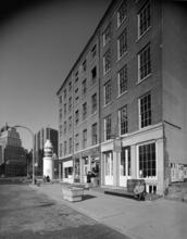 [Titanic Memorial Lighthouse and stores on Fulton Street.]