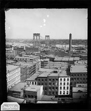 [Brooklyn Bridge under construction.]