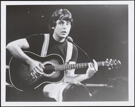 ["Beatlemania" theater still.]